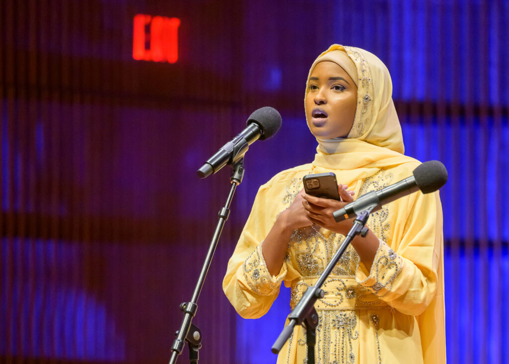 Muna Abdulahi performs a poem at the inauguration of St. Paul’s first all-female City Council at the Ordway Center in St. Paul, Minn. on Tuesday, Jan. 9, 2024. Her spoken-word piece focused on the barriers women must overcome to have their voices heard. (Rich Ryan | richryan.com)